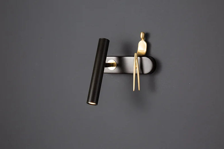 Minimalist Wall mounted Light with Seated human figure, Gold/Black