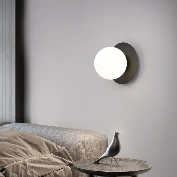 Simple Round Wall Lamp illuminating a stylish living room with modern decor and furniture.