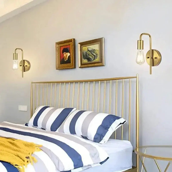 Nordic Bend Pipe Wall Lamp – Sleek Gold or Black Iron Lighting Fixture in a stylish bedroom setting.