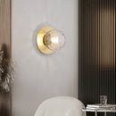 Simple Round Wall Lamp mounted on a modern wall, featuring a frosted glass shade and metallic base for stylish lighting.