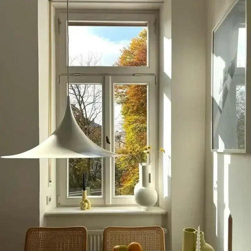 Scandi 70s Danish Pendant Lamp – Minimalist Metal LED Chandelier for Dining & Living Spaces illuminating a modern dining area.