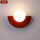 Halfmoon Metal Sconce in red color with LED light and modern design, suitable for stylish interiors.