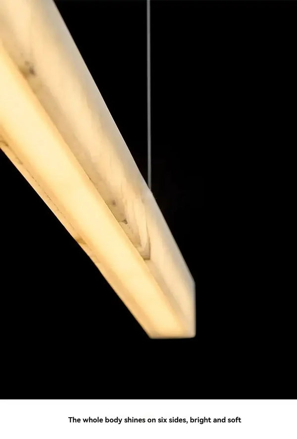 Natural Marble Linear Pendant Light 80–120cm showcasing a sleek design with warm integrated LED lighting.