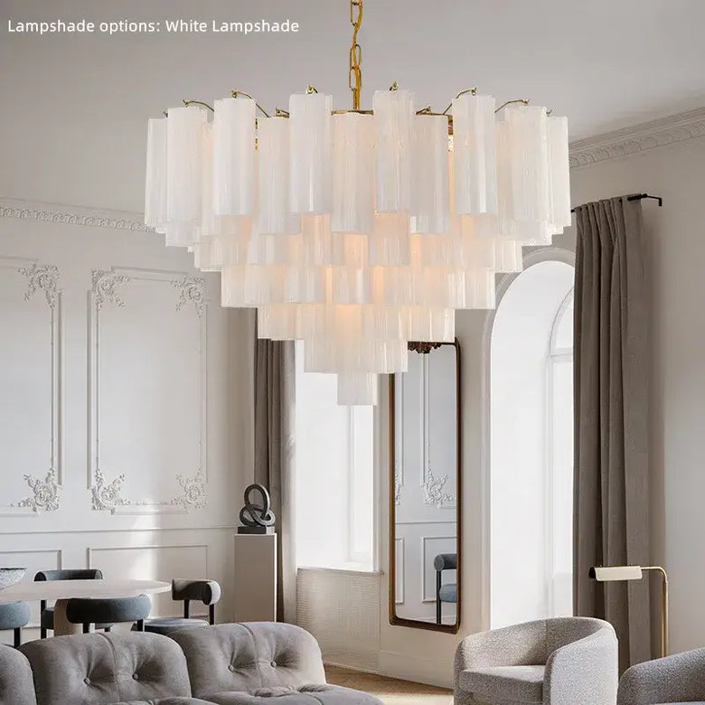 Murano Glass Tiered Chandelier with Gold Frame elegantly illuminating a modern dining room with white lampshade options.