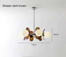 Rare Mid-Century Orange Plexiglass Chandelier: A Unique Vintage Gem with 6 heads and dark brown elements.