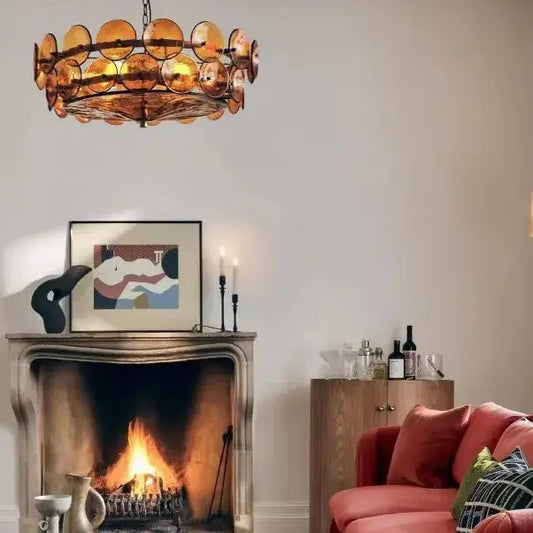 Luxurious  Glass Disc Chandelier – 50s Chic illuminating a cozy living room with a fireplace and stylish decor.