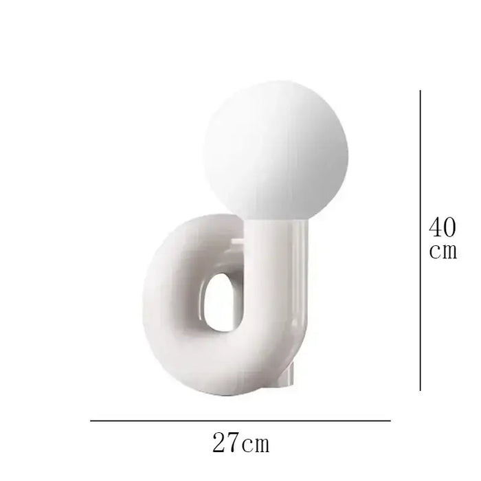 Sculptural Resin Table Lamp – Italian-Inspired Modern Lighting featuring a frosted glass globe.