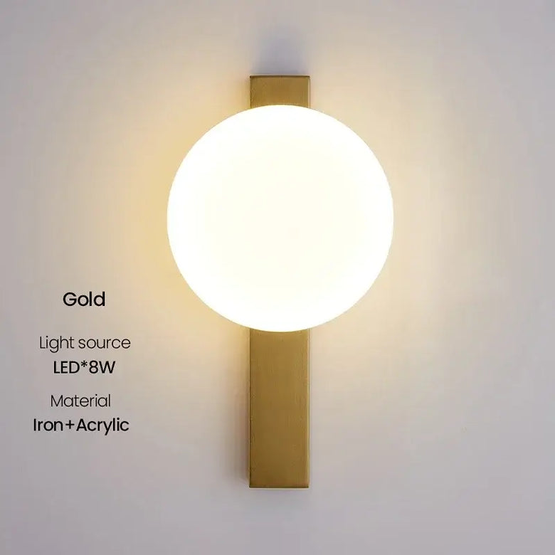 Decorative Lighting Fixture With Milk White Glass Sphere - Stylish wall-mounted lamp with gold finish and acrylic shade.