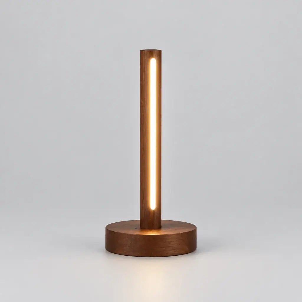 A modern cylindrical LED desk lamp with a warm glowing vertical light bar and a round wooden base,