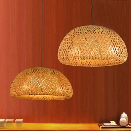 Chic Mid-Century Rattan Chandeliers hanging over a wooden surface, featuring woven rattan design and soft patterned light.