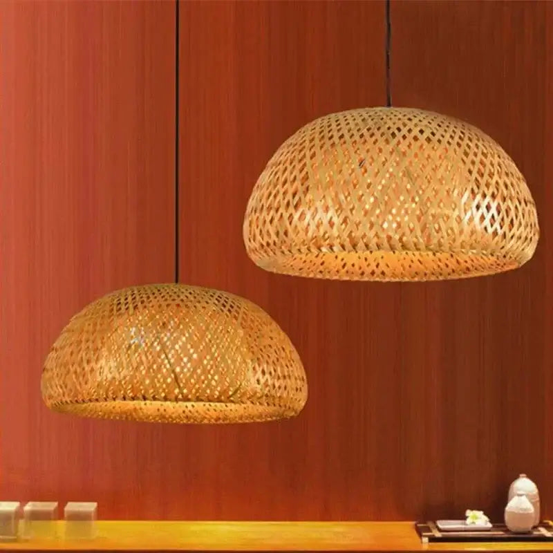 Chic Mid-Century Rattan Chandeliers hanging over a wooden surface, featuring woven rattan design and soft patterned light.
