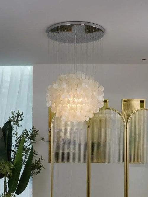 Elegant 70s Retro Shell Multi-String Light Pendant illuminating a modern interior space.