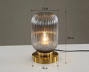Modern Nordic Glass Table Lighting Fixtures featuring elegant glass design and gold base, adding sophistication to any decor.