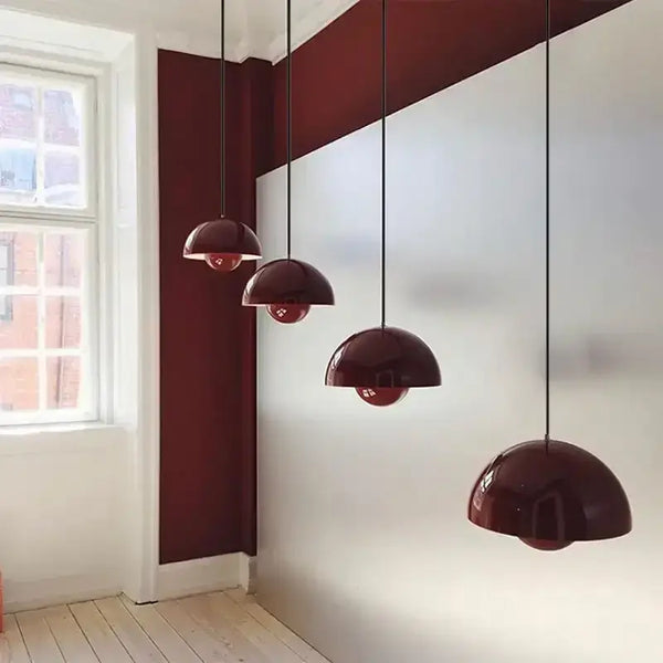 Contemporary Pendant Light in red color hanging in a modern kitchen setting with a stylish design.