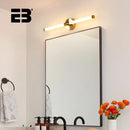 Contemporary Vanity Wall Light with etched glass shade above a modern mirror in a stylish bathroom setting.