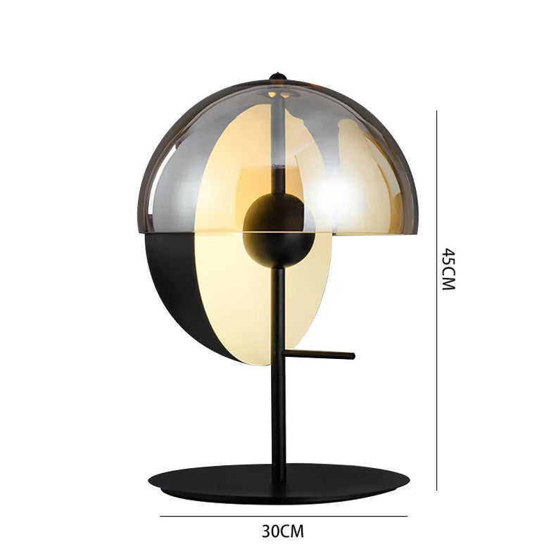 Modern table lamp with black and gold design, dimensions indicated on a white background