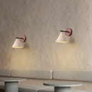 Natural Travertine Stone Wall Lamp – Modern LED Sconce for Bedrooms elegantly illuminating a cozy space.