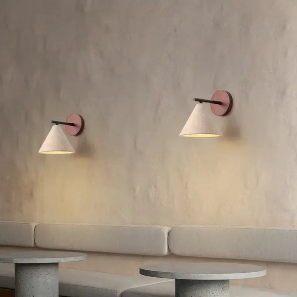 Natural Travertine Stone Wall Lamp – Modern LED Sconce for Bedrooms elegantly illuminating a cozy space.