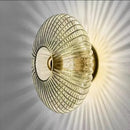 Radiant Modern Glass Wall Lamp with a captivating glass ridge pattern and radiant light effect.