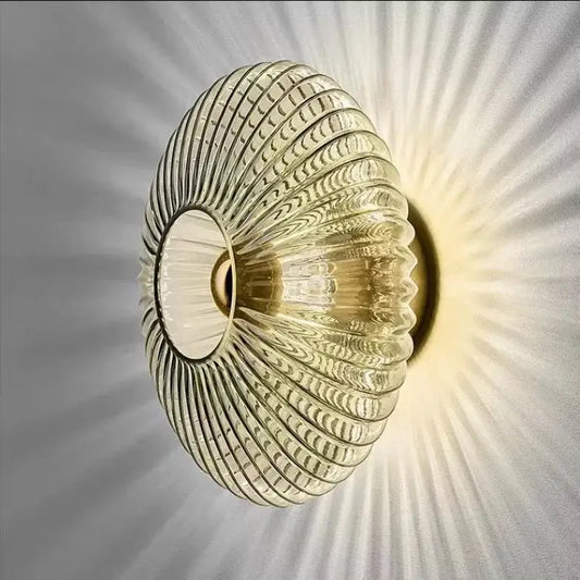 Radiant Modern Glass Wall Lamp with a captivating glass ridge pattern and radiant light effect.