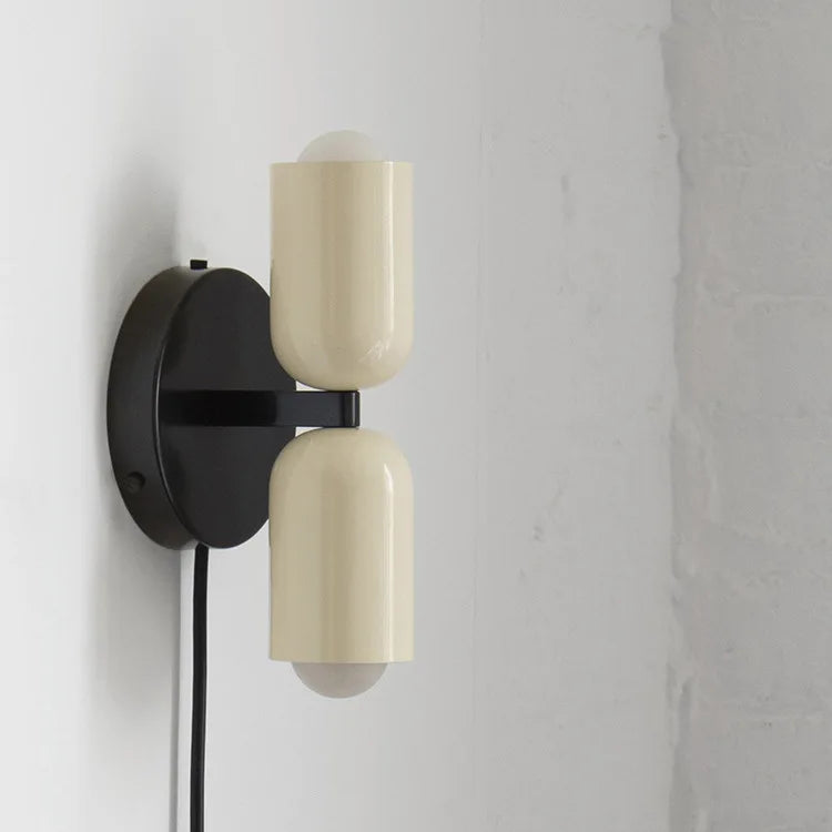 Postmodern Two-Tone Pill Wall Sconce, on black plate