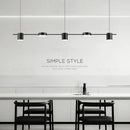 Hanging Minimalism Lights showcasing a stylish and modern design over a dining table in a contemporary setting.