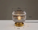 Modern Nordic Glass Table Lighting Fixtures with smoky gray glass and gold base, perfect for home decor.