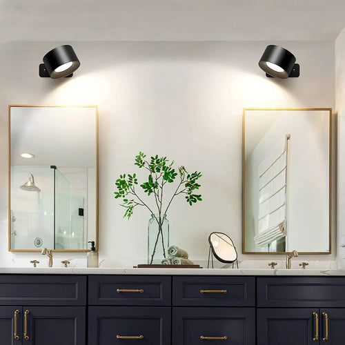Rechargeable Bedside Wall Lamp illuminating a stylish bathroom with mirrors and greenery.
