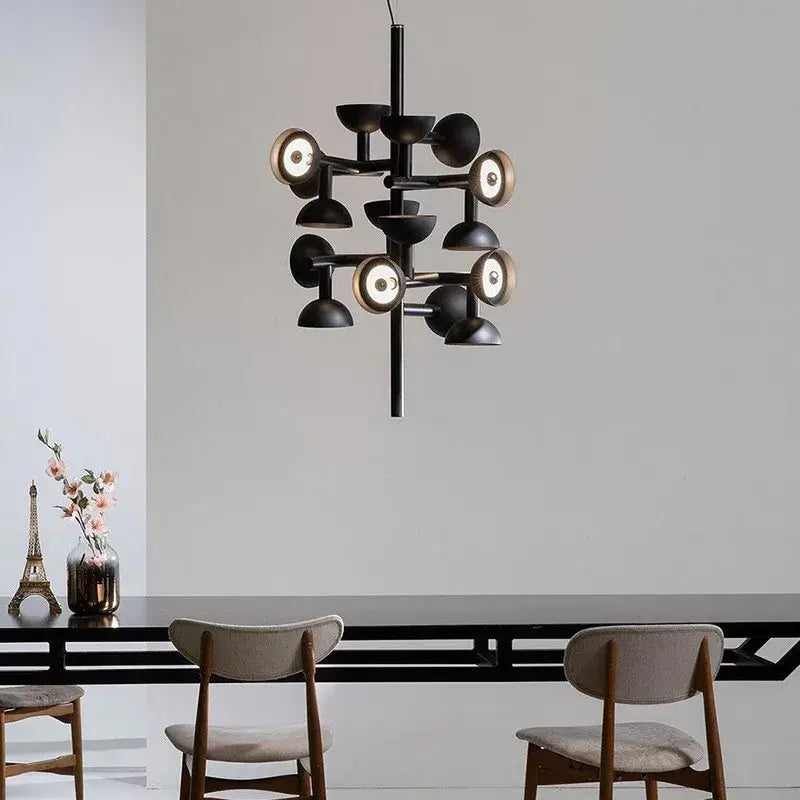 Danish Postmodern LED Chandelier – Sculptural Black Designer Pendant Light illuminating a stylish dining area.