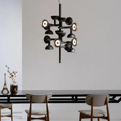 Danish Postmodern LED Chandelier – Sculptural Black Designer Pendant Light illuminating a stylish dining area.