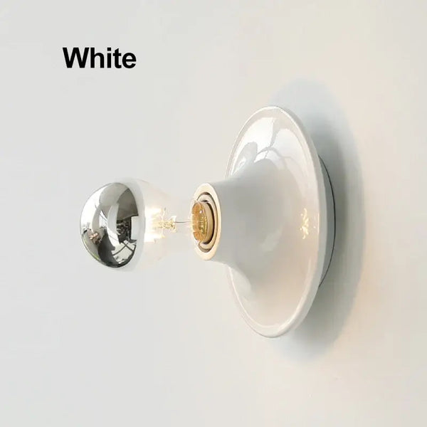 80s revival wall light in white with a stylish UFO shape and shiny bulb for modern decor.