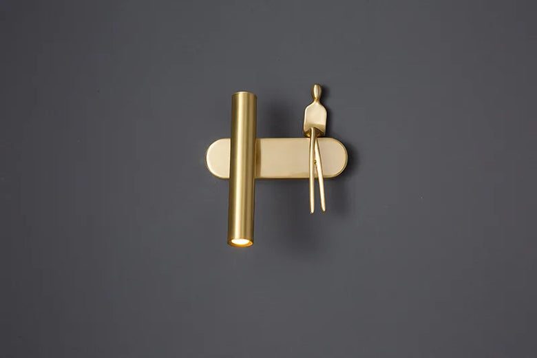 Minimalist Wall mounted Light with Seated human figure, Gold/Black