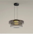 Layered Glass Pendant Light – Modern Amber, Green or Smoke Grey LED Suspension hanging from the ceiling.