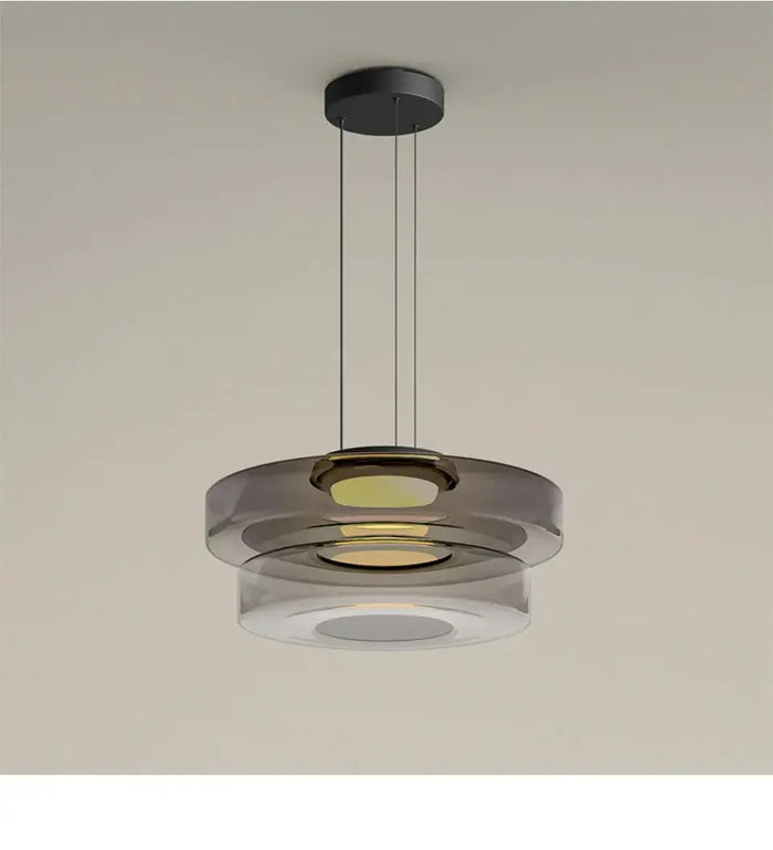Layered Glass Pendant Light – Modern Amber, Green or Smoke Grey LED Suspension hanging from the ceiling.