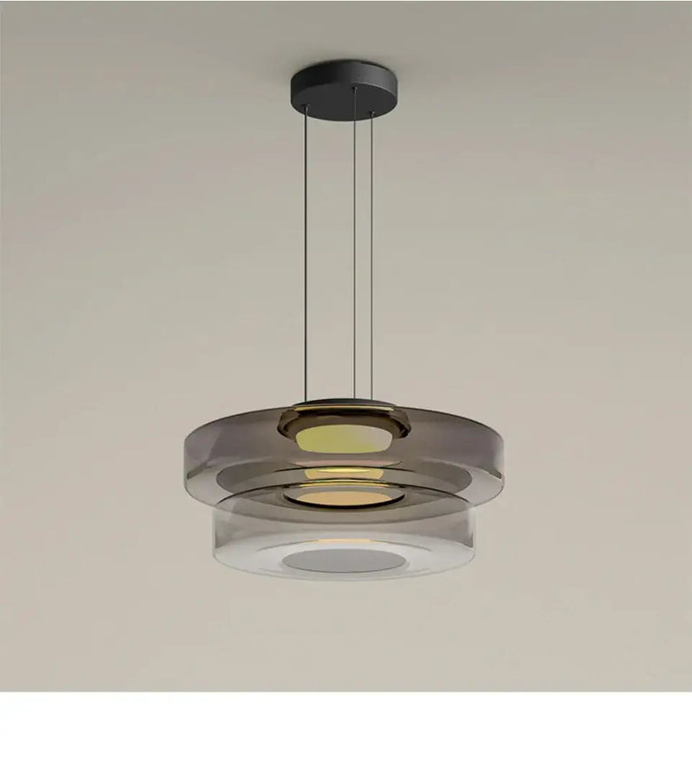 Layered Glass Pendant Light with modern design, featuring layered glass shades and sleek black canopy.