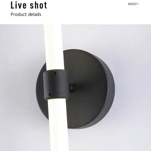 Close-up of the Postmodern Tube Pipe Wall Light showcasing the black fixture and fluorescent tube design.