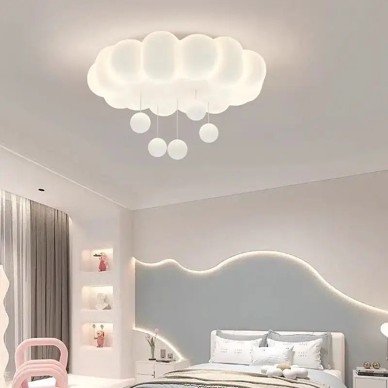 Modern White Cloud-shaped LED ceiling light illuminating a stylish bedroom with soft glow and playful design.
