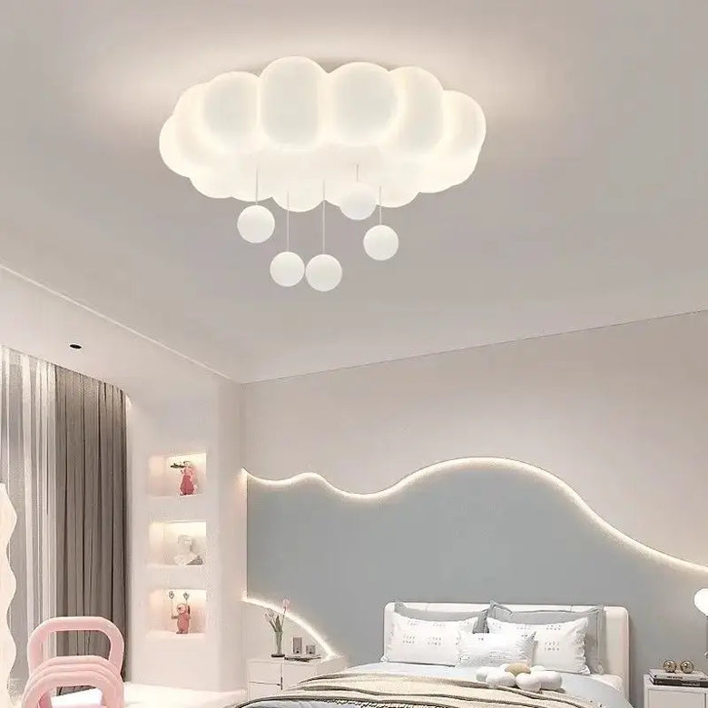 Modern White Cloud-shaped LED ceiling light illuminating a stylish bedroom with soft glow and playful design.