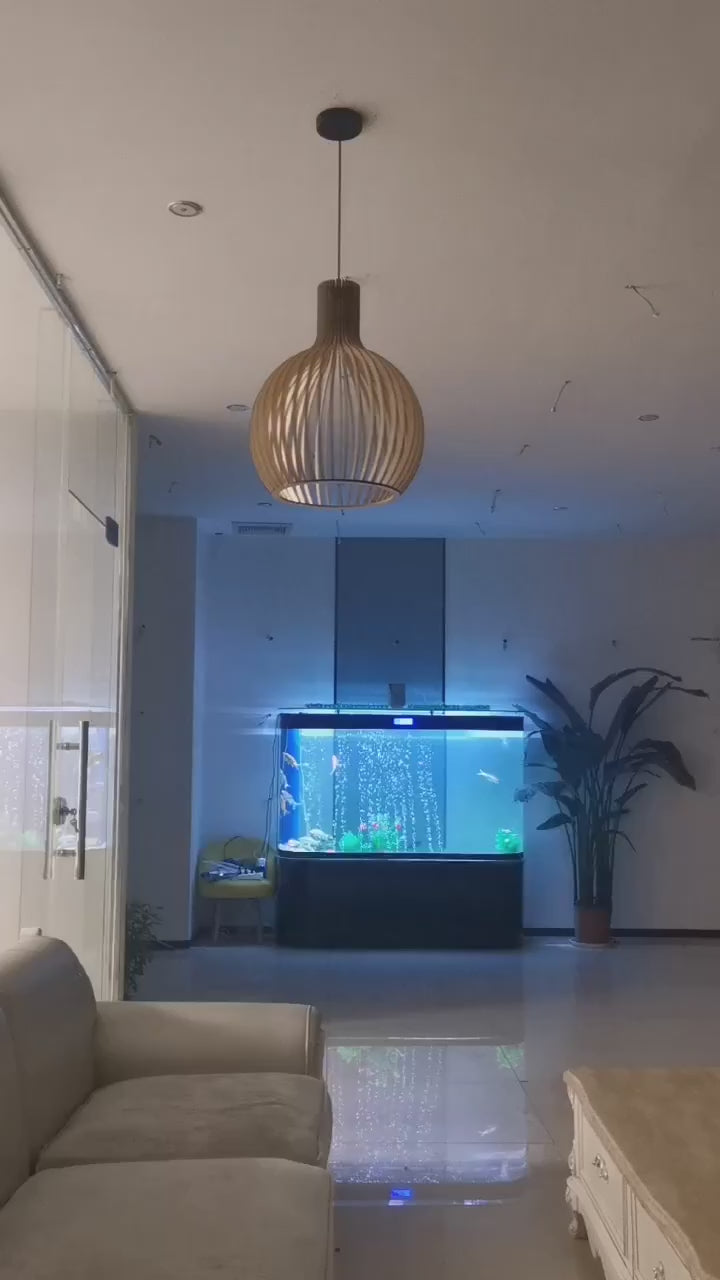 Nordic Retro Modern Wood Cage Pendant in room with fish tank and plants, modern lighting decor