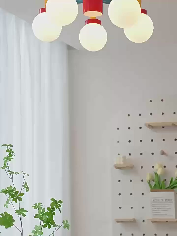 Lego like playful and colourful wall & ceiling light in a children's room, featuring vibrant globes and a modern design.