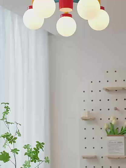Lego like playful and colourful wall & ceiling light in a children's room, featuring vibrant globes and a modern design.
