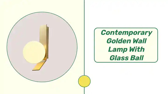 Contemporary Golden Wall Lamp with Glass Ball featuring a distinctive wrought iron angle and brushed brass finish for modern elegance.