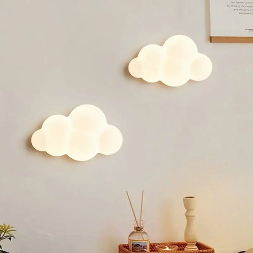 Cordless cloud wall light nursery displayed on a wall, featuring soft glow and whimsical cloud design.